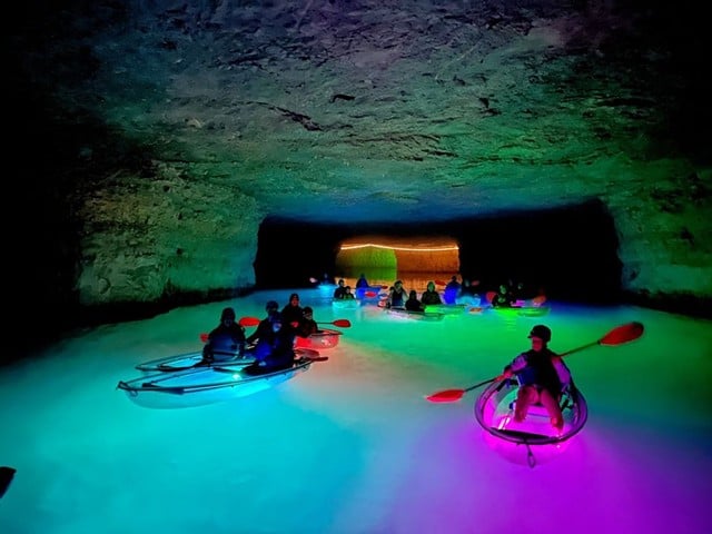 Glow Cave Kayaking
Have you ever seen an underground waterfall? That’s just one highlight of SUP Kentucky’s Mine Glow, their most popular cave kayaking Kentucky adventure in Red River Gorge.
You’ll paddle through an abandoned limestone mine by the glow of your LED lights and your headlamp. Keep an eye out for rainbow trout who often follow the tour. If you’re lucky, you’ll see a Kentucky brown bat taking a rest on the limestone walls.