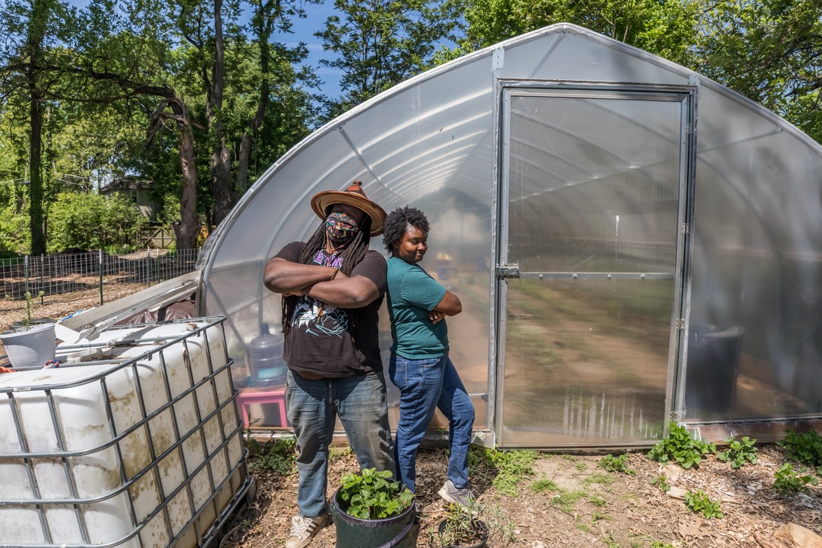 Michael George and Mariel Gardner are the creators of 5th Element Farms, an urban food garden on Wilson Avenue. Photo by Kathryn Harrington.