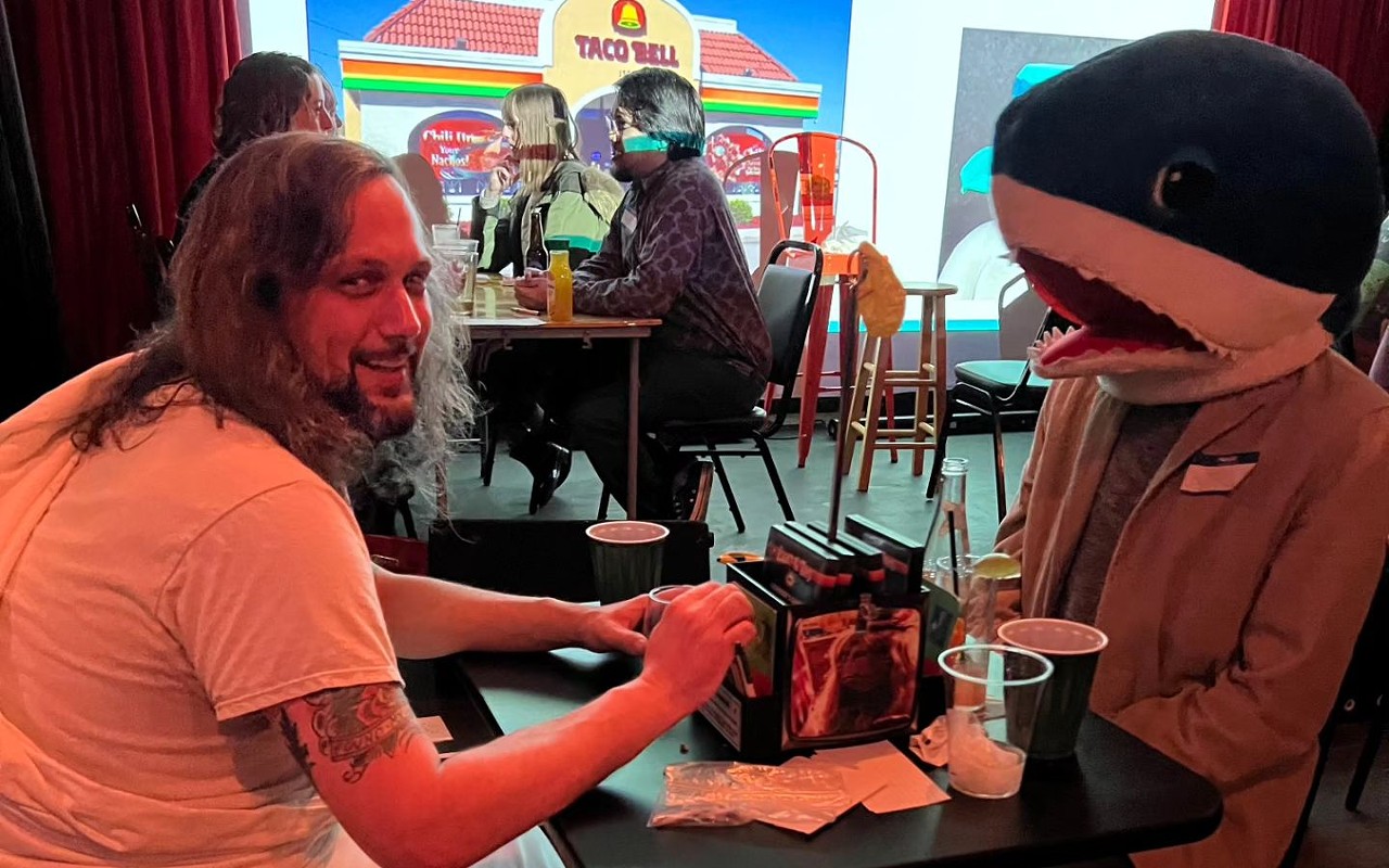 "Jesus" (comedian Zach Brumback), left, and comedian Kyle McGlothlin, right, at a previous Unhinged Speed Dating at Planet of the Tapes.