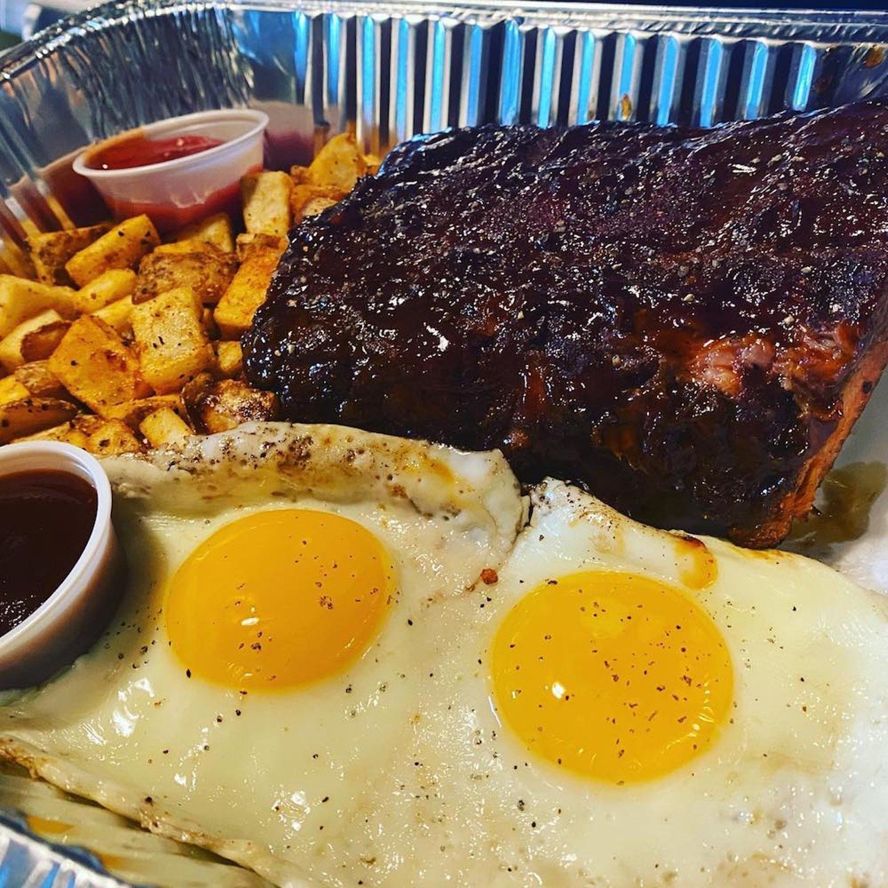 Four Pegs
1053 Goss Ave.
Four Pegs is known more for its reliably good beer selection and burgers, but they also have a solid brunch.
Featured in the photo is Pork Belly Hash &#150; pork belly burnt ends with fried potatoes topped with two fried eggs and BBQ drizzle.
