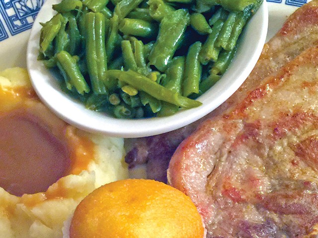 Grilled pork-chop dinner with mashed potatoes and gravy, green beans and muffin at Cottage Inn