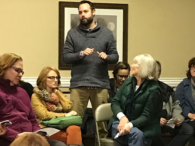 Ryan Eller of Define American, an immigrant advocacy organization, speaks at the Indivisible Kentucky meeting.