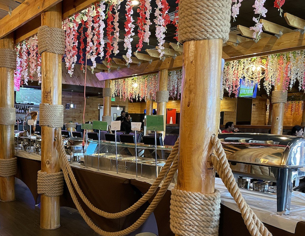 The buffet at Paradise American-Indian Cuisine, seen from behind, offers an unexpectedly nautical look with masts and naval ropework, an inheritance from Million Crab, its predecessor in the space.