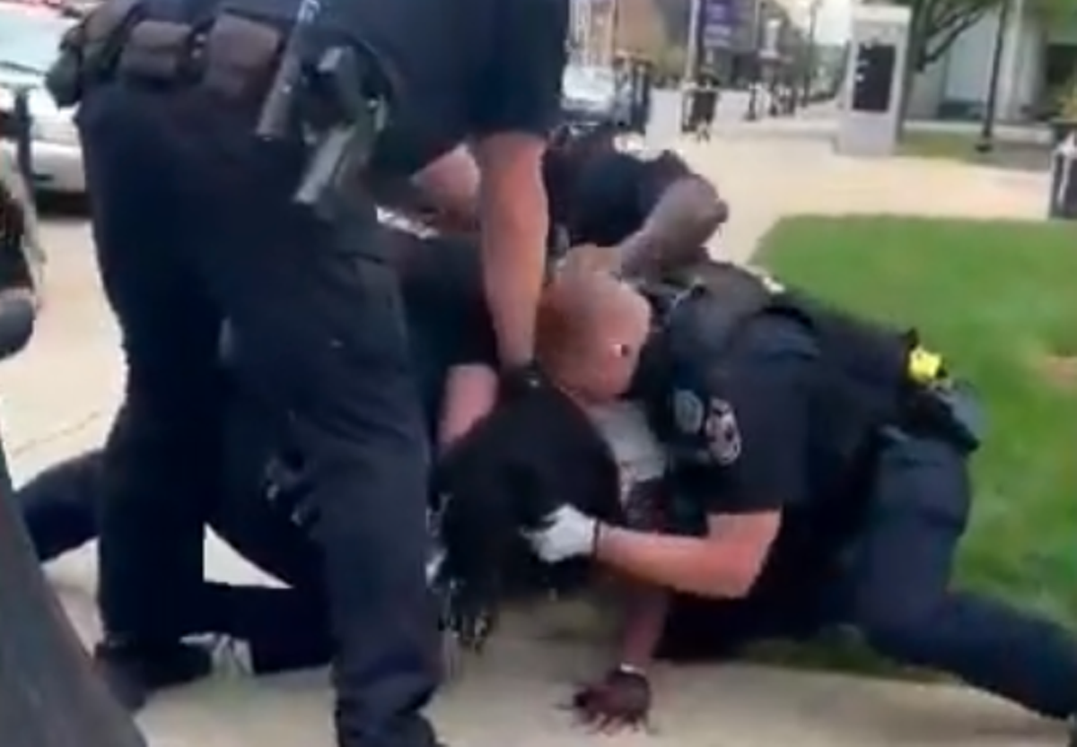 Footage from an onlooker shows Dee Garrett being arrested by Louisville police.