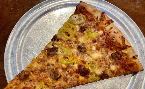 The Post is famous for its oversize, New York City style pizza by the slice, which changes daily. Spicy sausage, banana peppers, and feta cheese did well by this tasty slab.