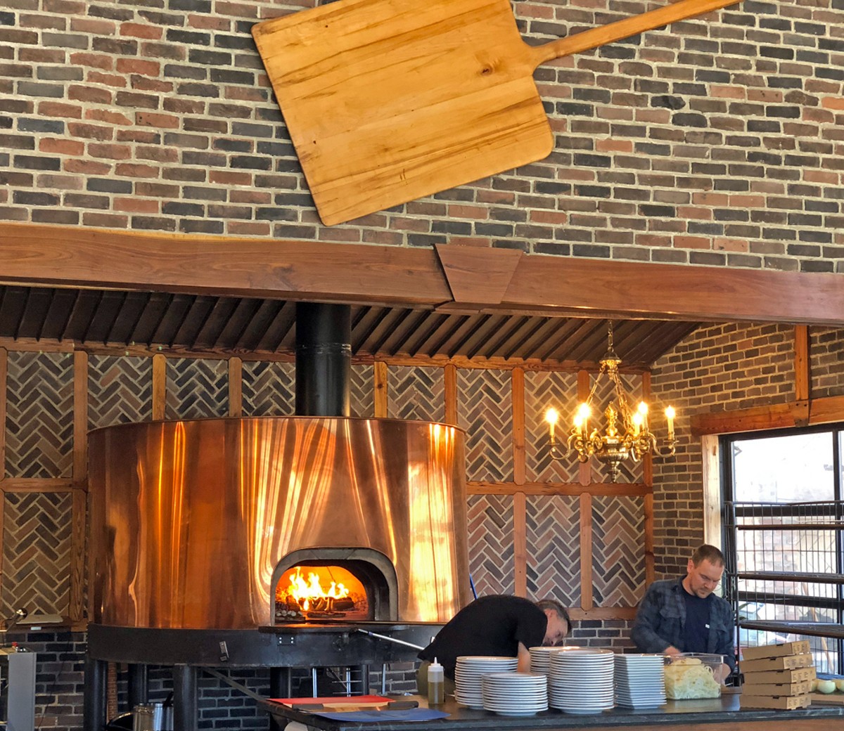 MozzaPi&#146;s bright brass pizza oven turns out excellent pies with its fierce wood fire.