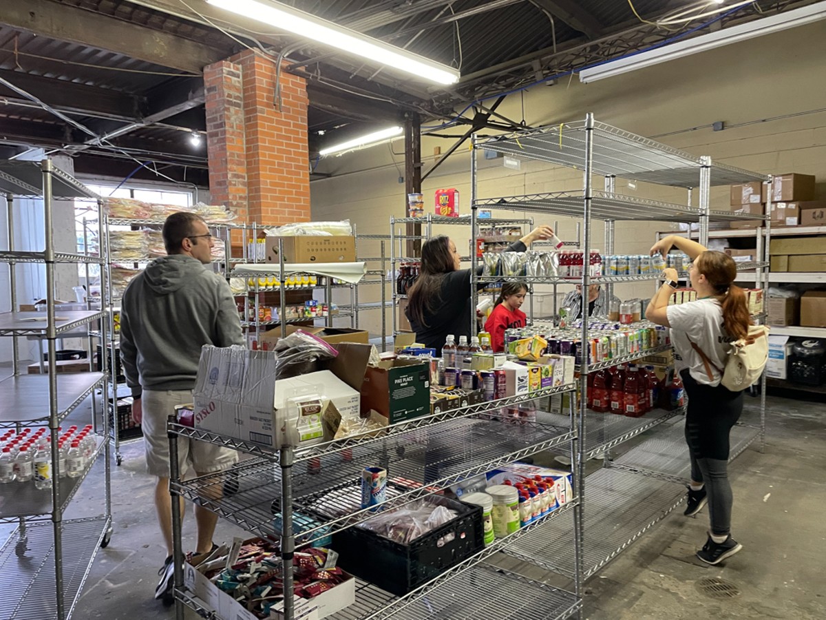 Volunteers get busy in Feed Louisville's food-rescue processing area.