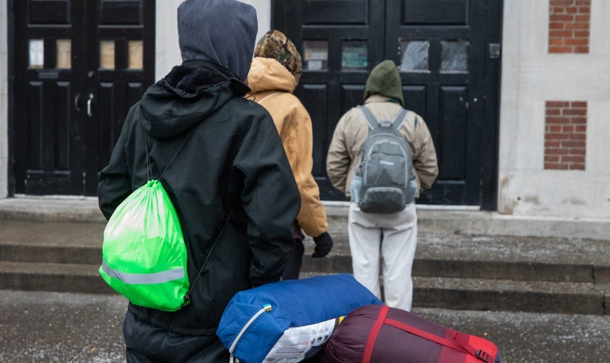 People lining up outside the St. John Center for Homeless Men in January of 2021.