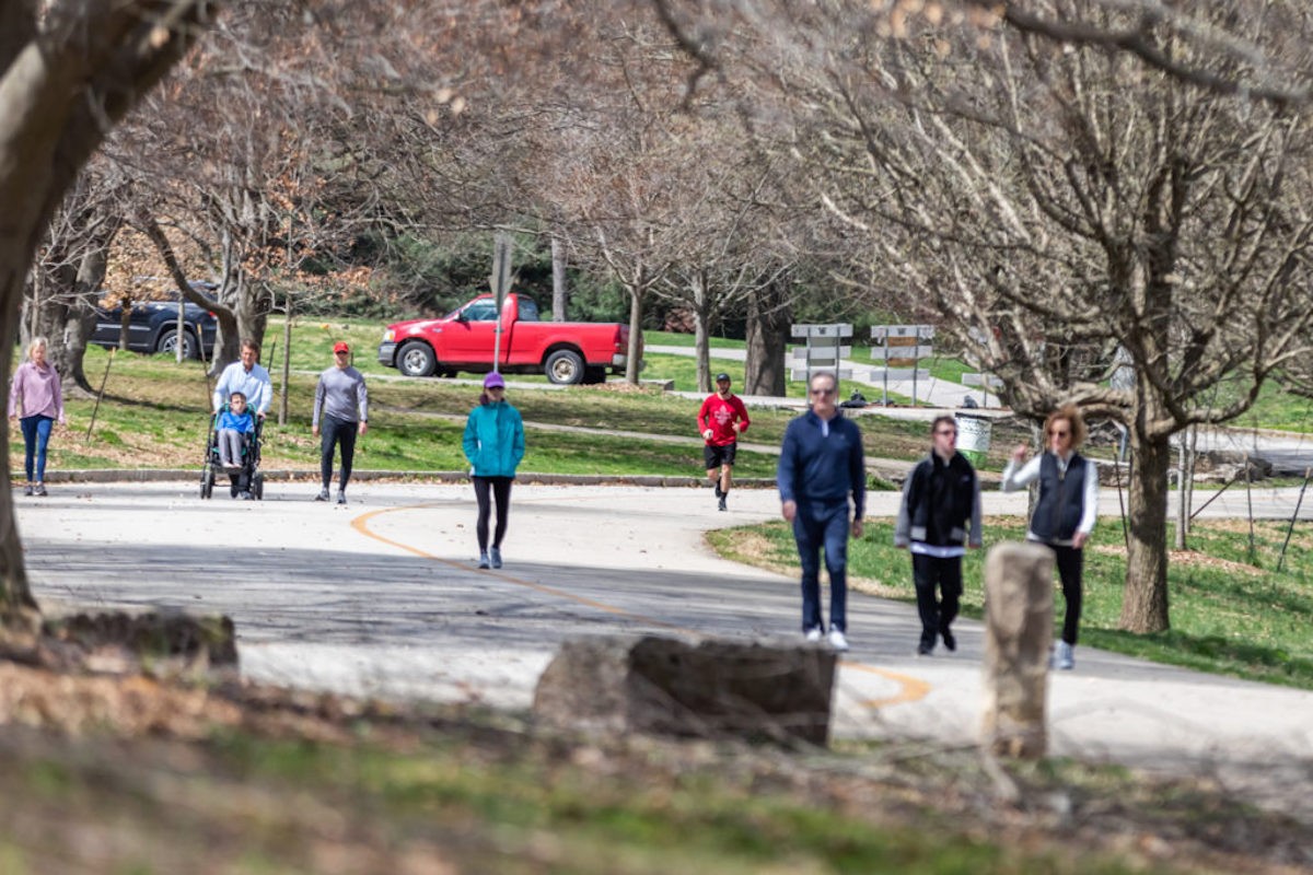 Pedestrians on the Scenic Loop in Cherokee Park.  |   Photo By Kathryn Harrington