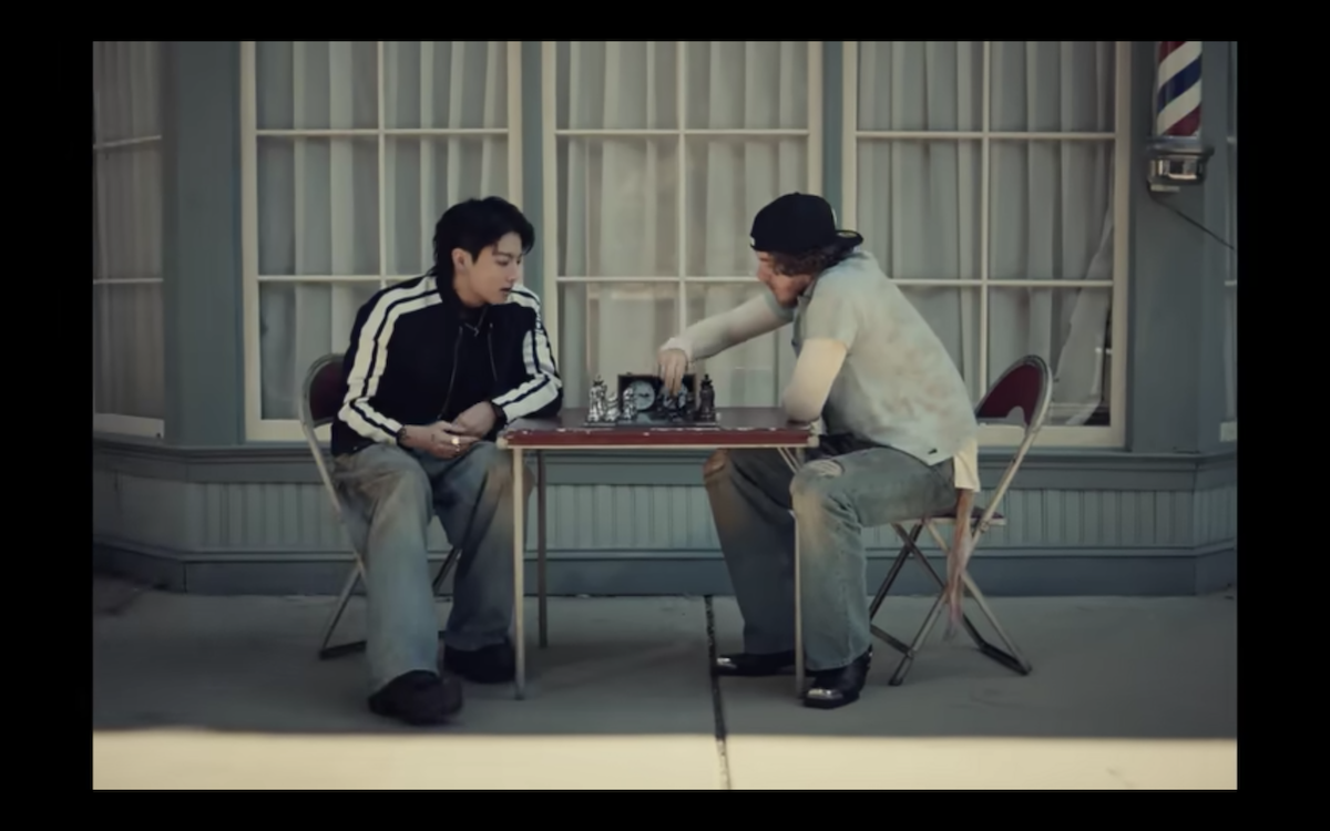 BTS idol Jungkook and Jack Harlow play chess in a scene from "3D."