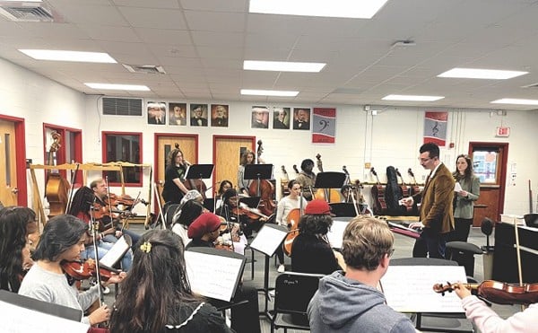 Composer Tanner Porter talking to the the Waggener High School orchestra in March rehearsal.