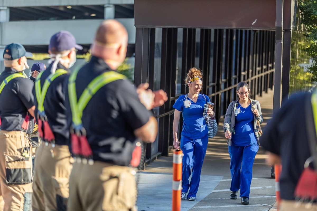 Healthcare workers arrived for their shifts Tuesday evening and were met with applause from Louisville police officers and firefighters.