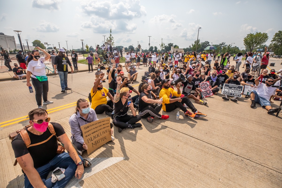 Protesters gathered on Central Avenue outside of Churchill Downs on Tuesday where many sat in the road.