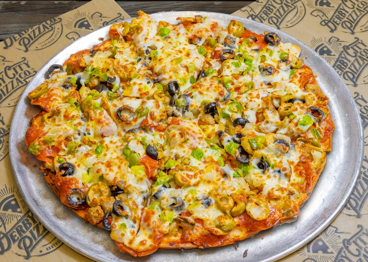 Derby City Pizza Co.
5603 Greenwood Rd.; 10619 W. Manslick Rd.; 2500 Crittenden Dr.; 2331 Brownsboro Rd.; 9910 Linn Station Rd.; 12900 Dixie Hwy.; 587 North Bardstown Road, Mt. Washington; 412 West Daisy Lane, New Albany, IN
10? The Champ  Pizza 
Our fans&#146; favorite, THE CHAMP, and our signature best seller, the 10 inch undisputed CHAMP lives up to it&#146;s name, and yes, it's loaded with our best sausage, pepperoni, onions, green pepper, mushrooms, black olives and our classic mozzarella cheese.