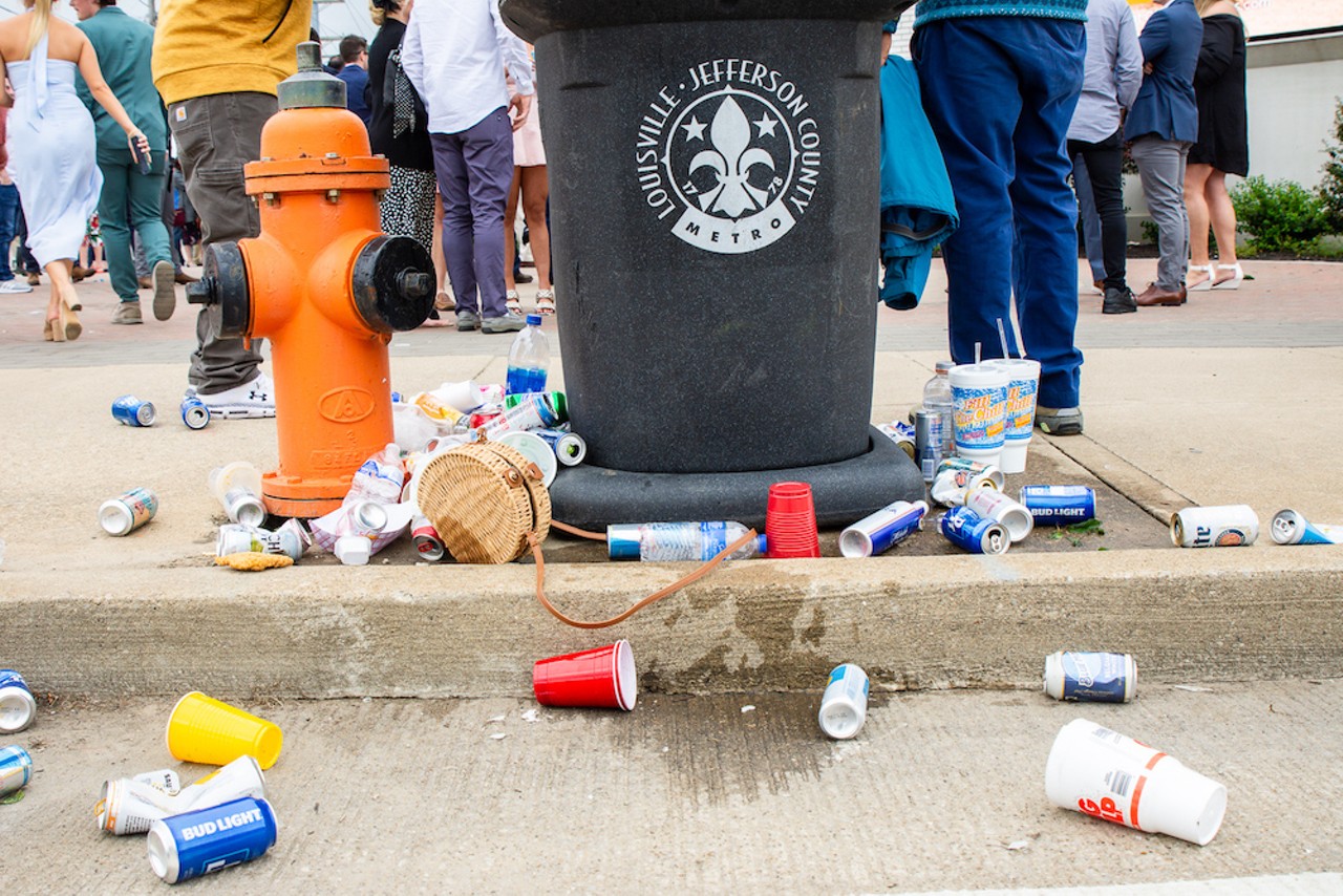 Trash outside the entrance to Churchill Downs.