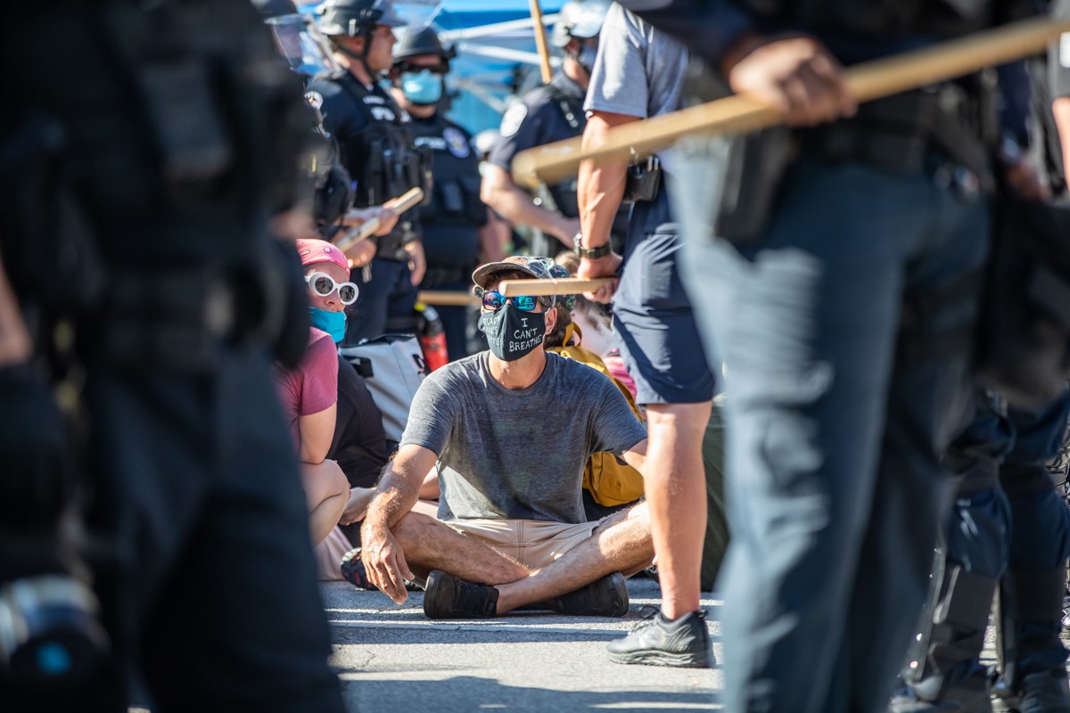 Protesters were surrounded by LMPD  and arrested after  they had placed barrels and other obstacles to block Market Street.