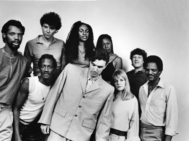 The Talking Heads lineup for the concert film 'Stop Making Sense.' From left: Steve Scales, Bernie Worrell, Jerry Harrison, Ednah Holt, David Byrne, Lynn Mabry, Tina Wemouth, Chris Frantz, and Alex Weir pose for a portrait in 1984.