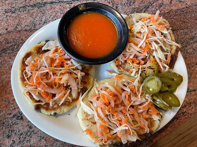 Pupusas, a popular dish across Guatemala, El Salvador, and Honduras, are thick, soft, tortilla-like flatbreads stuffed and topped with good things.