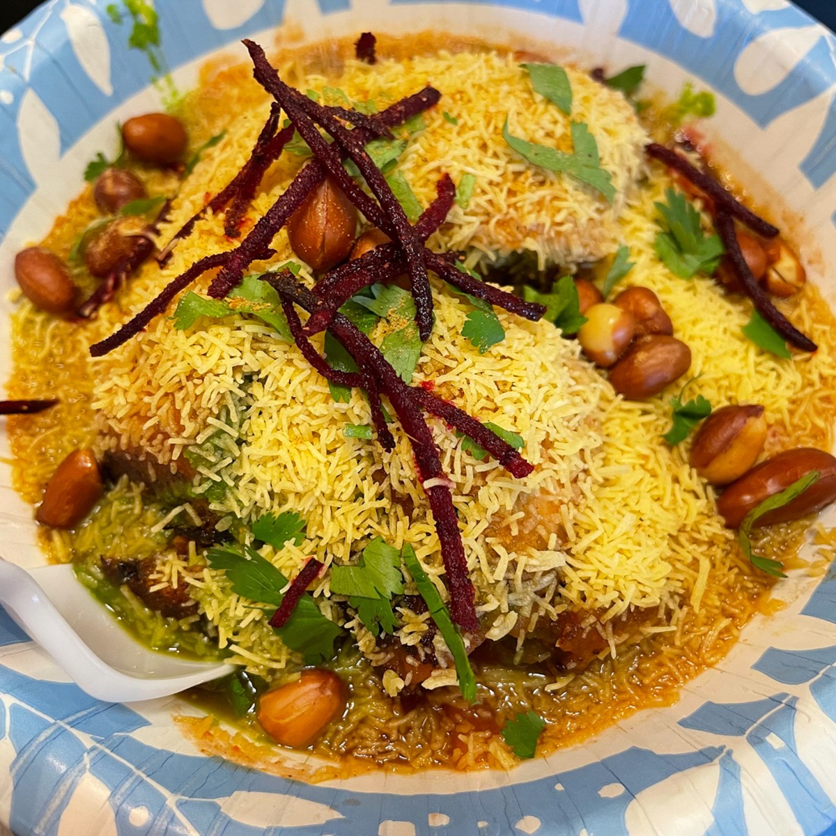 Chaat, the quintessential Indian street food, comes in a variety of tantalizing flavors and textures. Dabeli chaat was a spicy, fruity, and filling potato snack topped with peanuts and crunchy sev noodles.