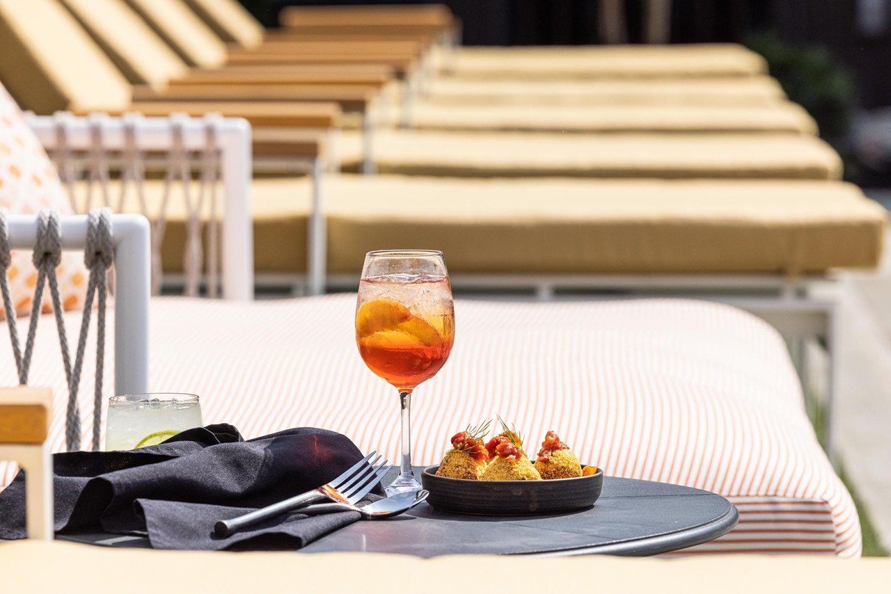 Paseo/Myriad Hotel Swim Club
Primavera Spritz
Enjoy poolside sips from Paseo with a day pass to Myriad Swim Club. Open Tuesday-Sunday, locals can snag a spot by the pool for just $10 each weekday. Enjoy the Primavera Spritz, a modern, seasonal take on a classic Mediterranean Aperol Spritz. Black tea infuses the Aperol with a smoky, earthy aroma while a house-made peach shrub adds a light, sweet touch.