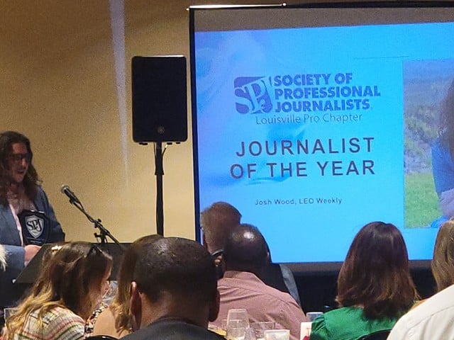 Former LEO News Writer Josh Wood accepts his award for Journalist of the Year.