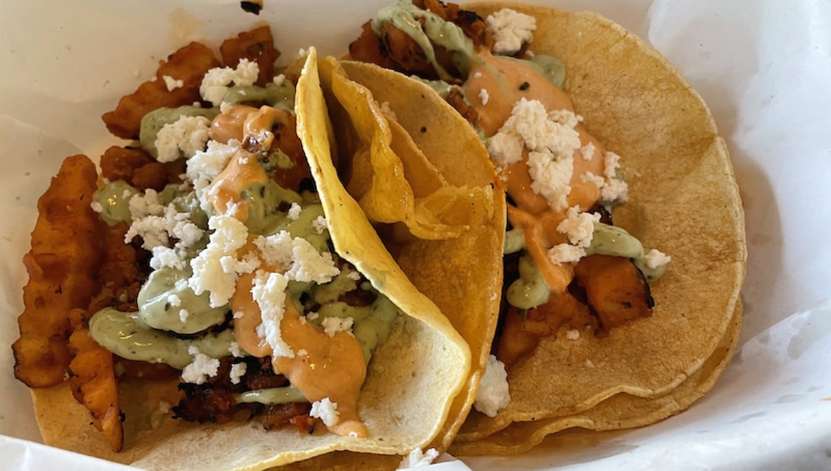 The soyrizo taco channels the idea of an Ensanada fish taco but with vegan chorizo and french fries rolled in crunchy fried tortillas.  |  Photos by Robin Garr.