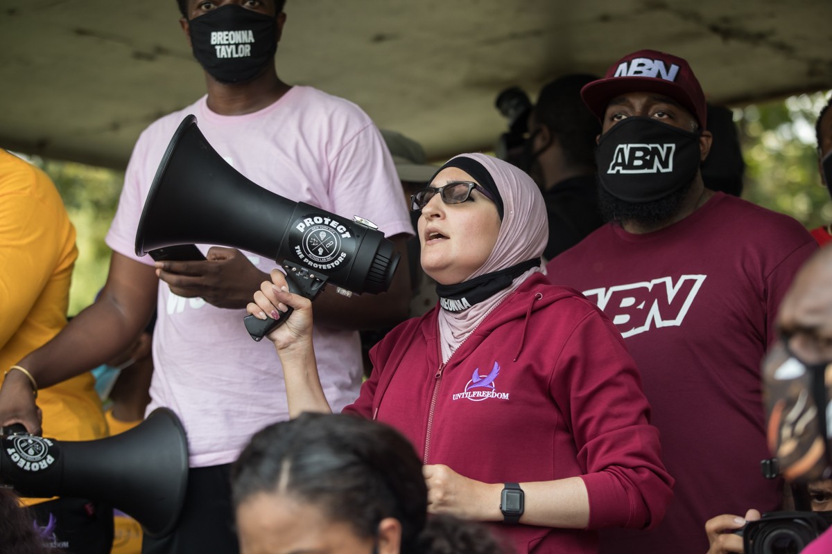 Co-founder of Until Freedom Linda Sarsour spoke to protesters in South Central Park on Tuesday before they began marching to the LMPD Training Academy. - KATHRYN HARRINGTON