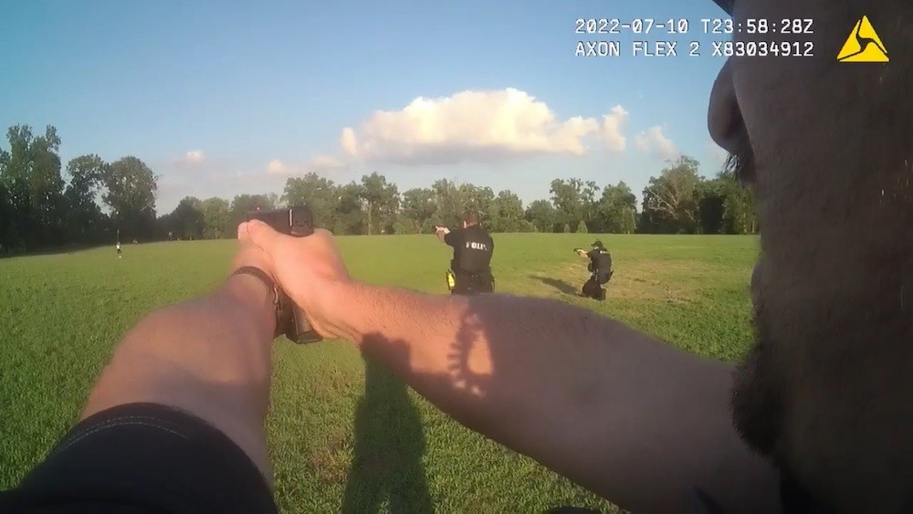 A screenshot from bodycam footage shows LMPD officers firing at Herbert Lee in Shawnee Park on July 10. &nbsp; | &nbsp;Photo via LMPD.