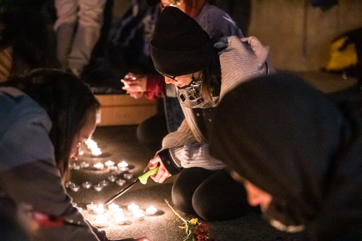 Candles were lit in Jefferson Square Park to spell out 'Travis' as the park filled with friends, family and fellow protesters to honor him. - KATHRYN HARRINGTON