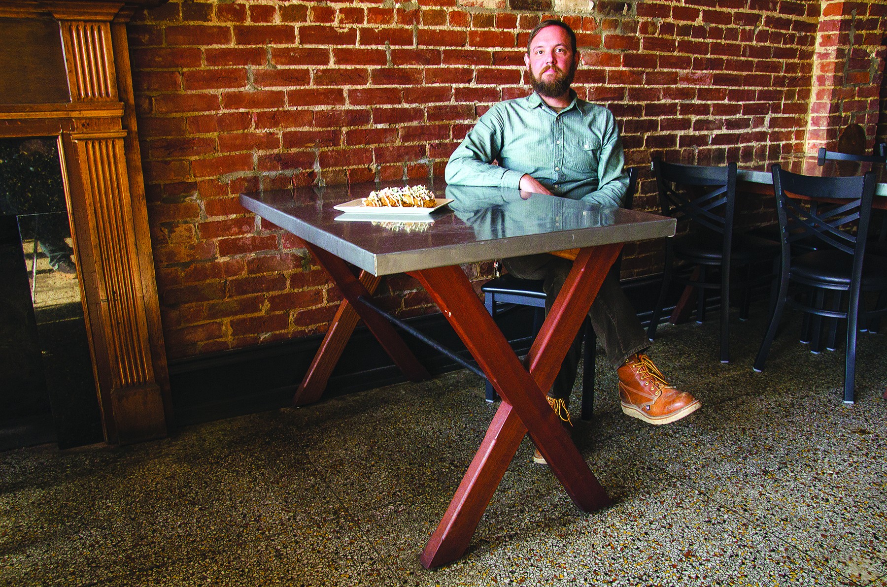 At Gospel Bird in New Albany, David Metcalf of Wooden Wire sits at one of his tables with a plate of Idgie & Ruth (fried green tomatoes, pimento cheese, slaw, horseradish). - photo by Nik Vechery