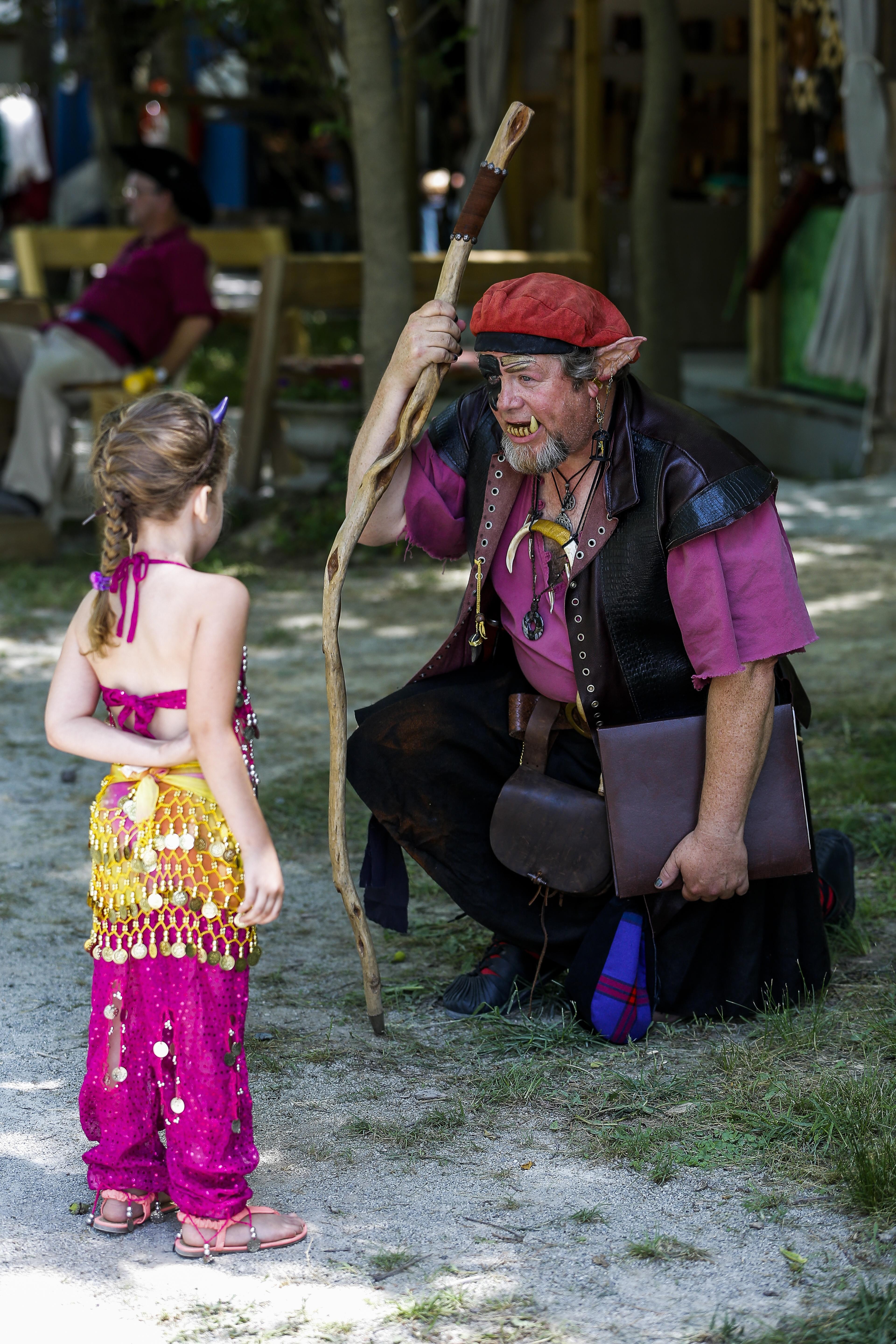 Ebenezer Grumpypants speaks to a young festival attendee.