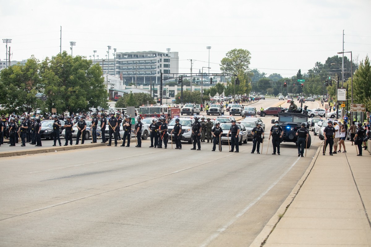 Police lined up at the bottom of the bridge on Central Avenue near Churchill Downs. - KATHRYN HARRINGTON