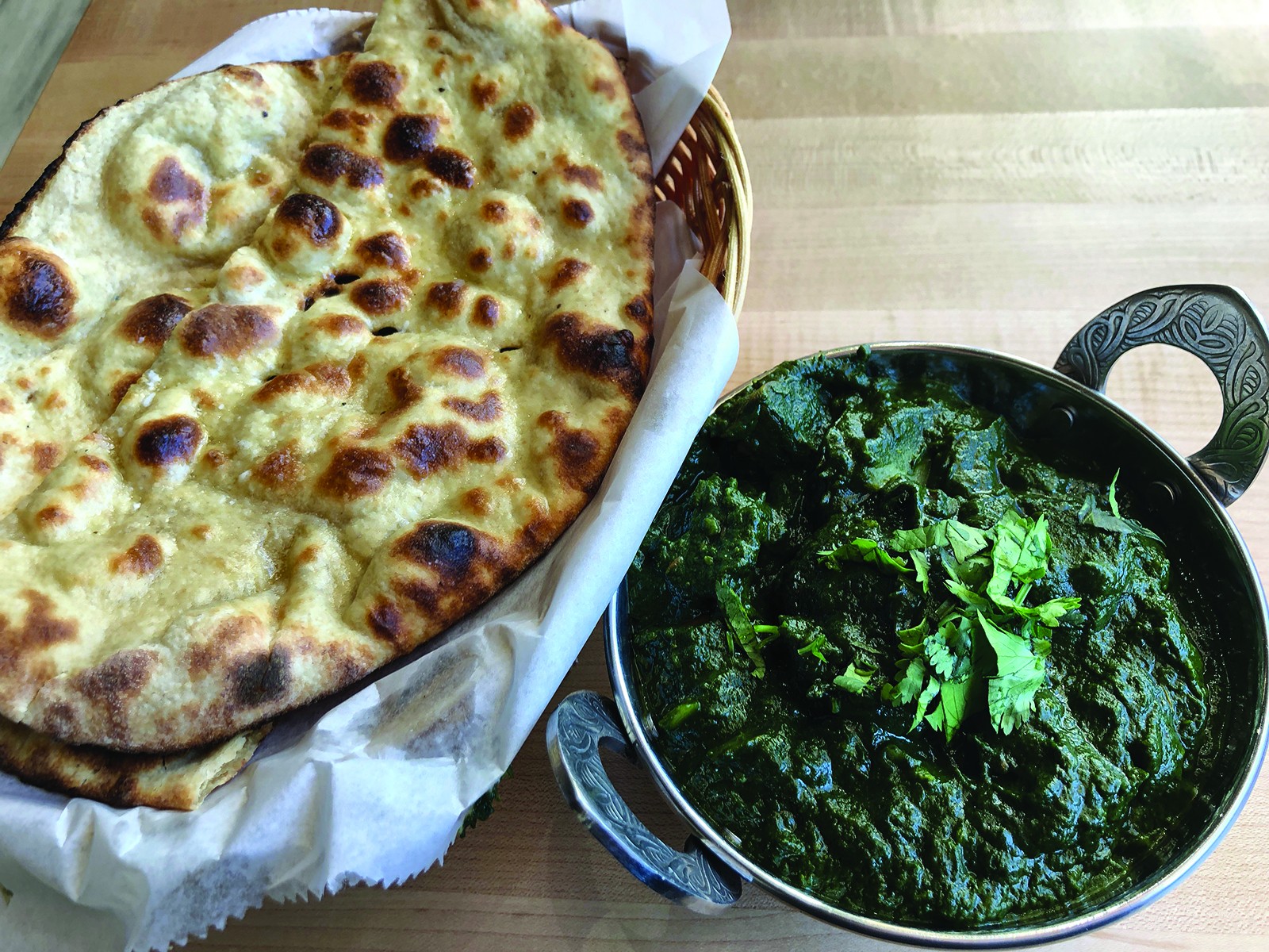 Honest's aloo palak blends spinach and potatoes in a filling, fiery masala-scented dish with roti bread.