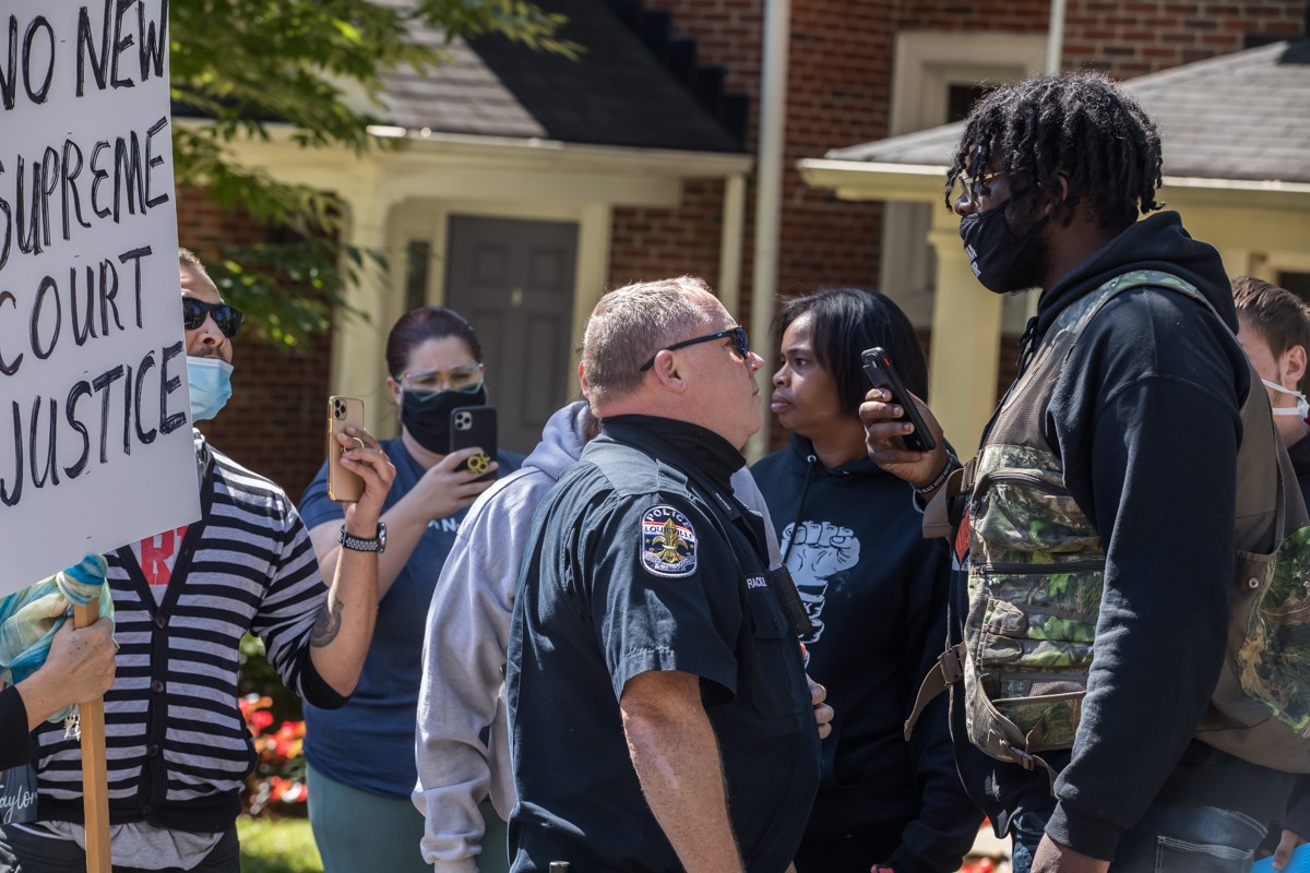 Police arrived at the protest outside of Sentator Mitch McConnell's home in the Highlands. - KATHRYN HARRINGTON