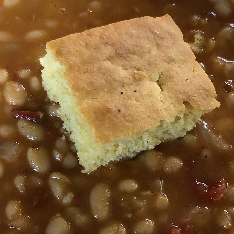 LuCretia's cornbread is light and crumbly and delicious. It went great here as a next-day add-on to our own Mexican beans.