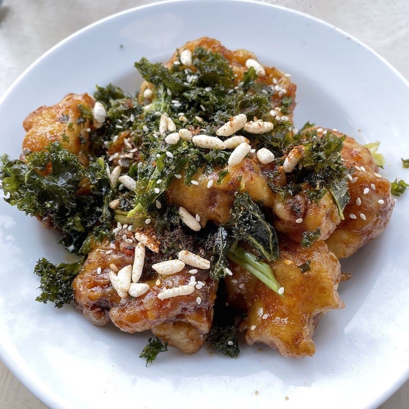 Naive&#146;s tempura cauliflower appetizer with kale garnish was a creatively imagined delight.