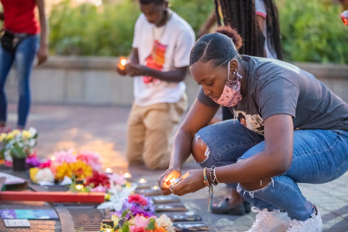 Protesters lit candles around the memorial in Jefferson Square Park that honors Breonna Taylor and other victims of police violence. - KATHRYN HARRINGTON