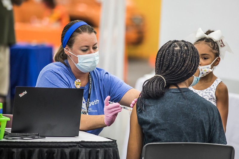 A Kentucky State Fair attendee getting vaccinated for Covid-19. - KATHRYN HARRINGTON