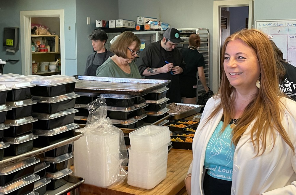 Feed Louisville's executive director and co-founder Rhona Bowles Kamar oversees a very active morning at work in Feed Louisville's kitchen at Douglass Boulevard Christian Church.