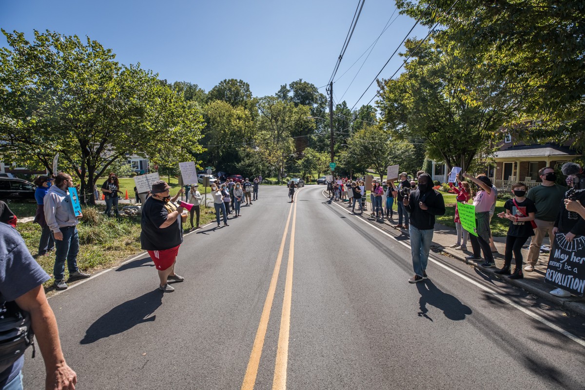 Protesters lined up on either side of Dundee Road on Saturday outisde of Mitch McConnell's home. - KATHRYN HARRINGTON