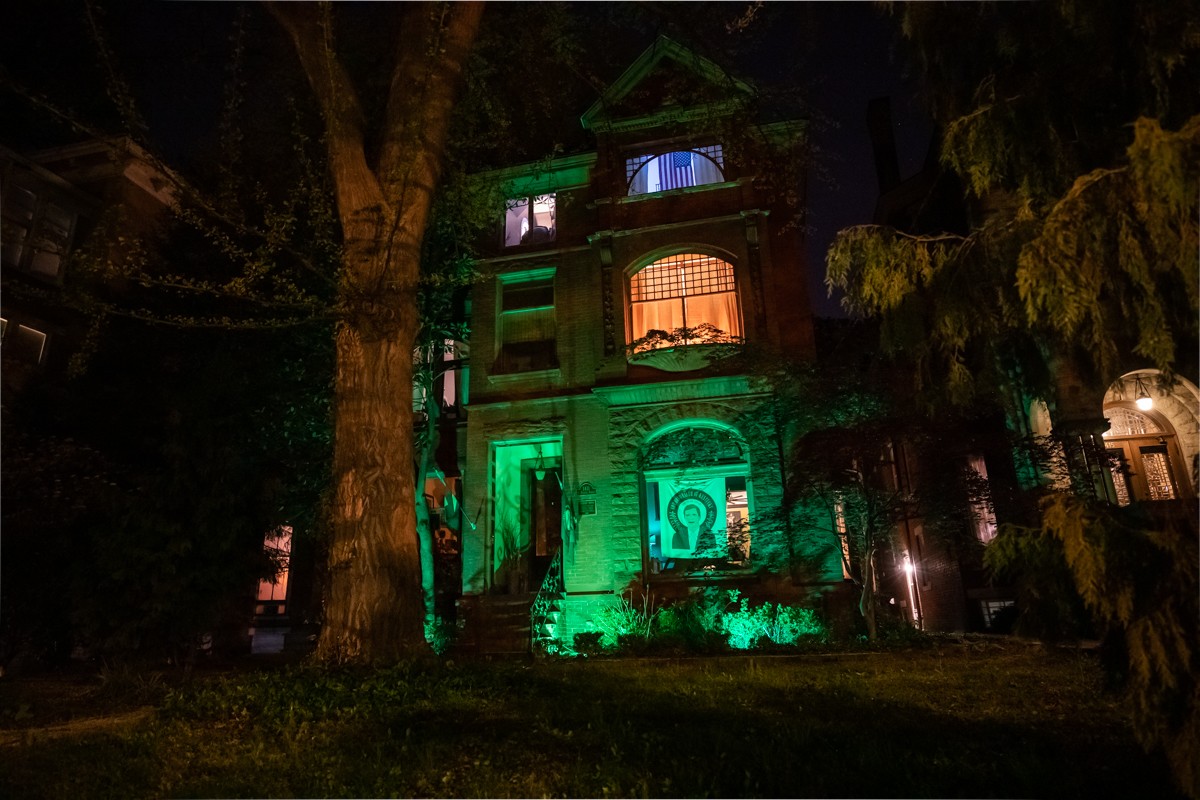 A home in Old Louisville is lit green as a symbol of compassion. - KATHRYN HARRINGTON
