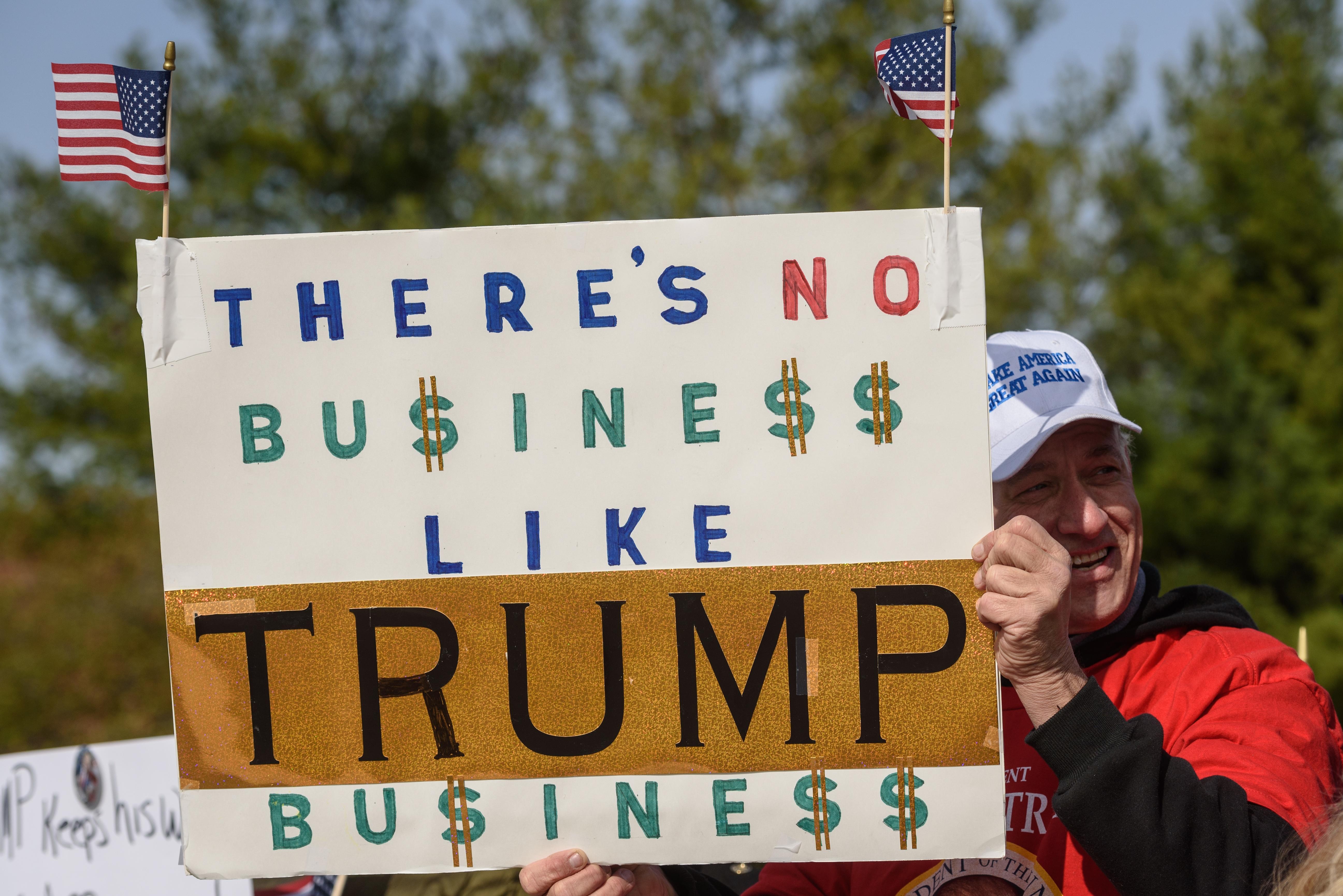 Trump supporter Mike Payne displays his sign. - BRIAN BOHANNON