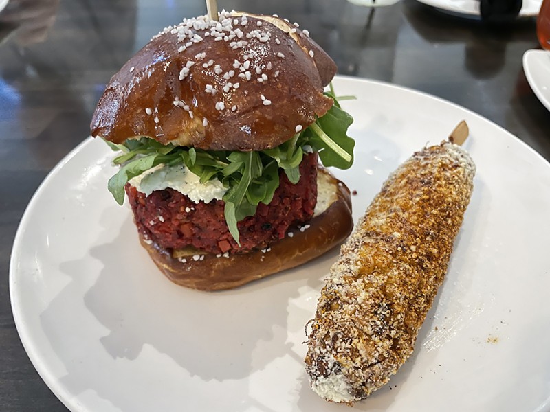 Mussel & Burger Bar's house-made veggie burger is an odd but delicious combination of beets, mushrooms and red quinoa, served with goat cheese and aioli on a tall pretzel bun.