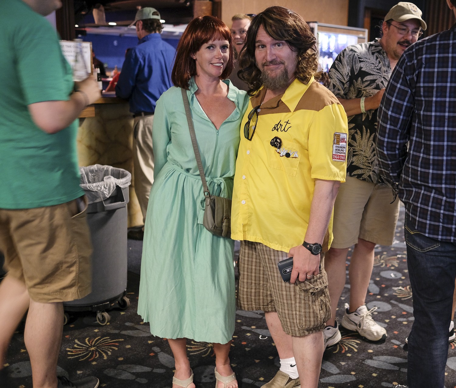 Melissa R. Marshall (left) and Perry Rintye (right) pose for a photo at Lebowski Fest.