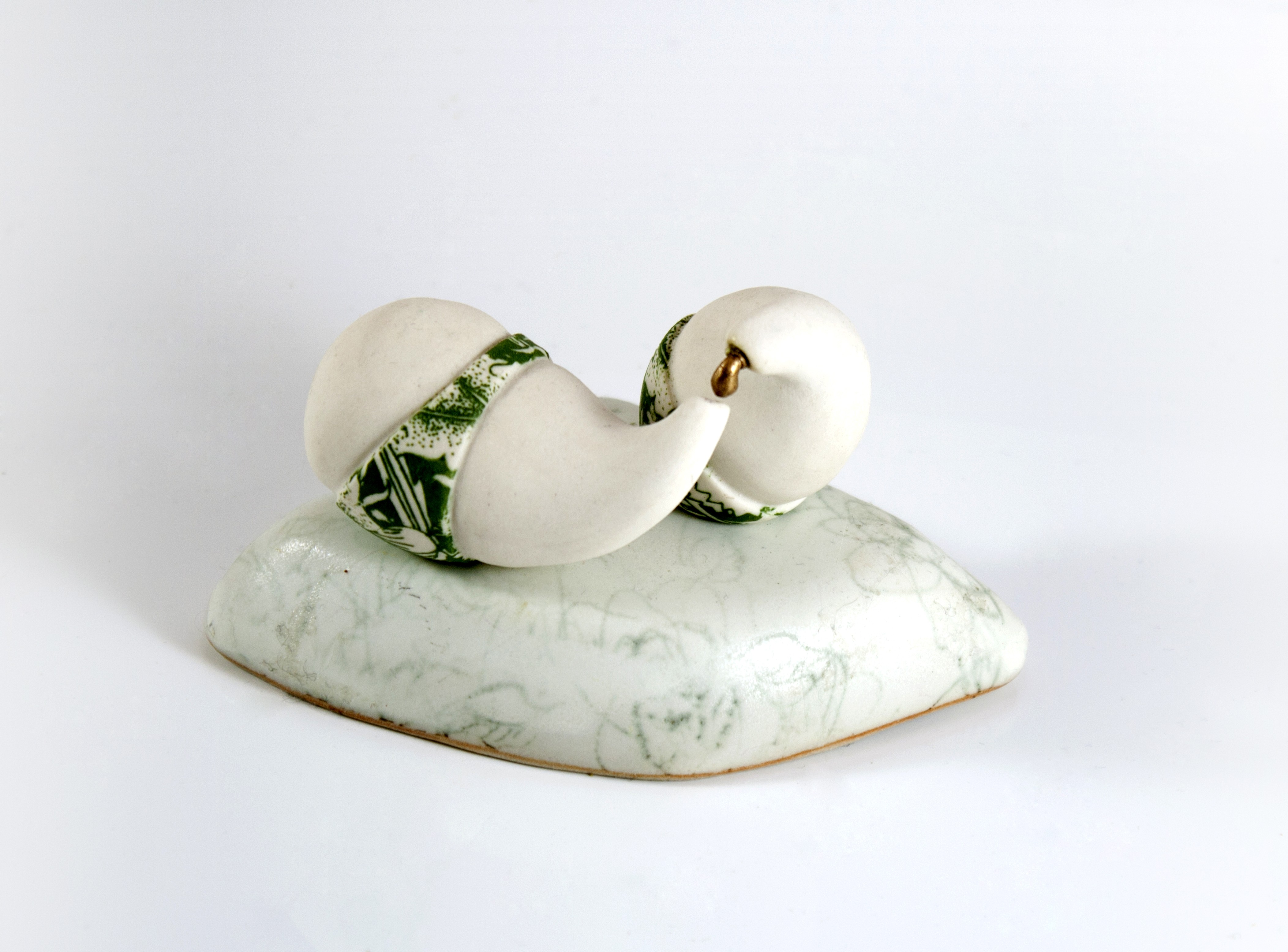 "Enticement" by Amy Chase. Porcelain, underglaze, luster.