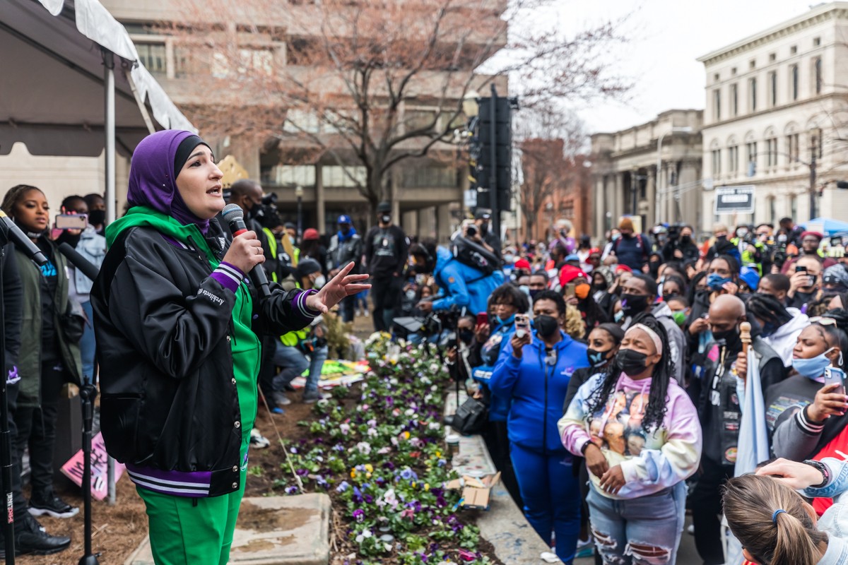 Linda Sarsour with Until Freedom spoke to the crowd in Jefferson Square on Saturday. - KATHRYN HARRINGTON