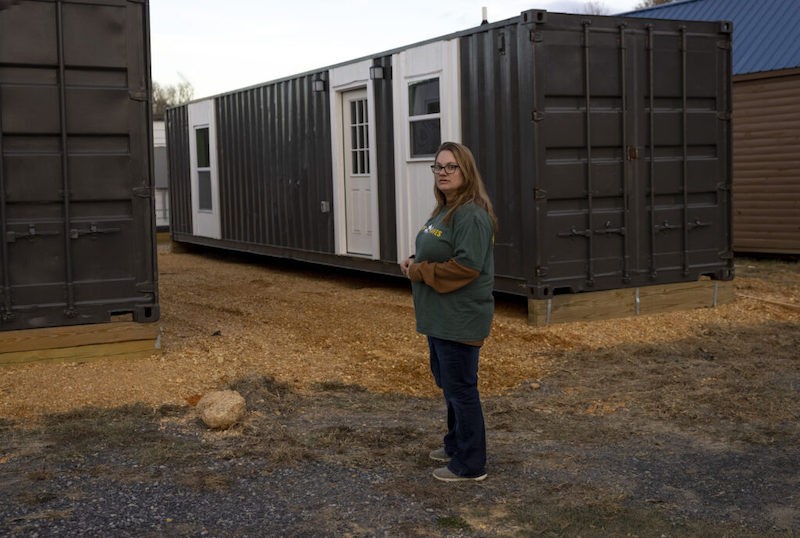 Office manager Cassy Basham stands outside of container homes Friday, November 18, 2022 at Camp Graves, which provides transitional housing for those in need, in Graves County, Kentucky. - Julia Rendleman for Kentucky Lantern