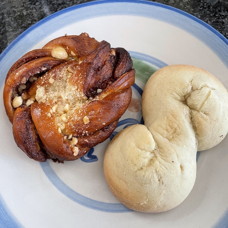 Two tasty Scandinavian pastries from Sm&oslash;r: A chocolate-hazelnut cardamom pastry, akin to a Danish (left) and a light-as-air, almond-scented kringla cookie.