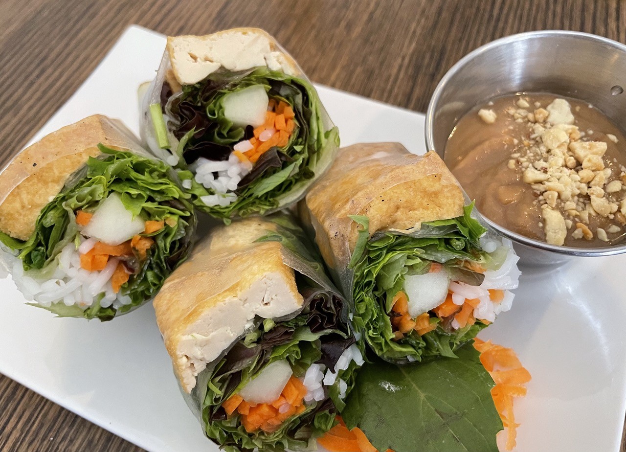 Oversize Vietnamese spring rolls shine through their tender rice paper wrappers.