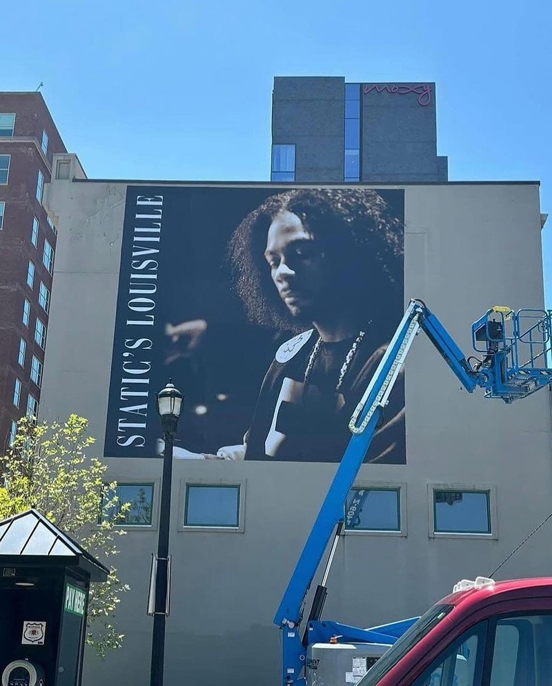 Installation of the newest "Hometown Heroes" banner at Roots 101 African American Museum. - Louisville Hood News via Facebook